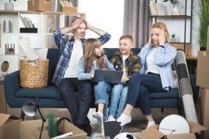 Caucasian family preparing stuff for relocation
