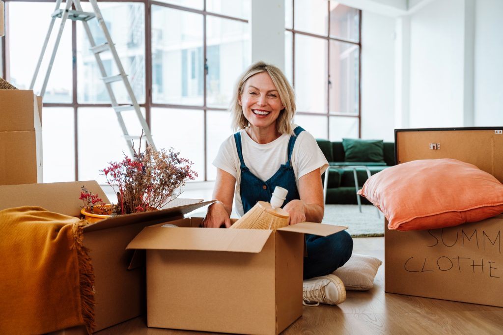 Single woman relocating in a new apartment