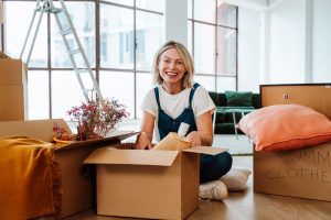 Single woman relocating in a new apartment