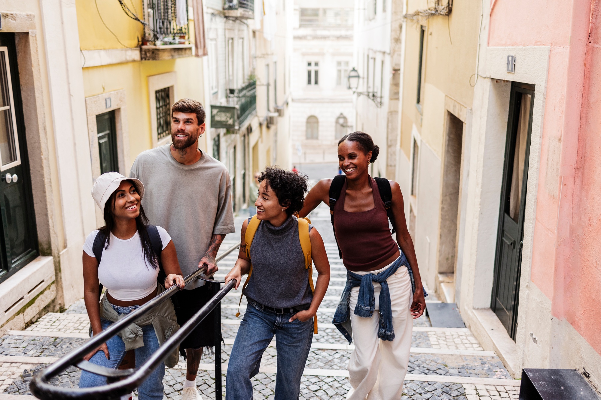 Group of tourists walking down stairs in lisbon, portugal